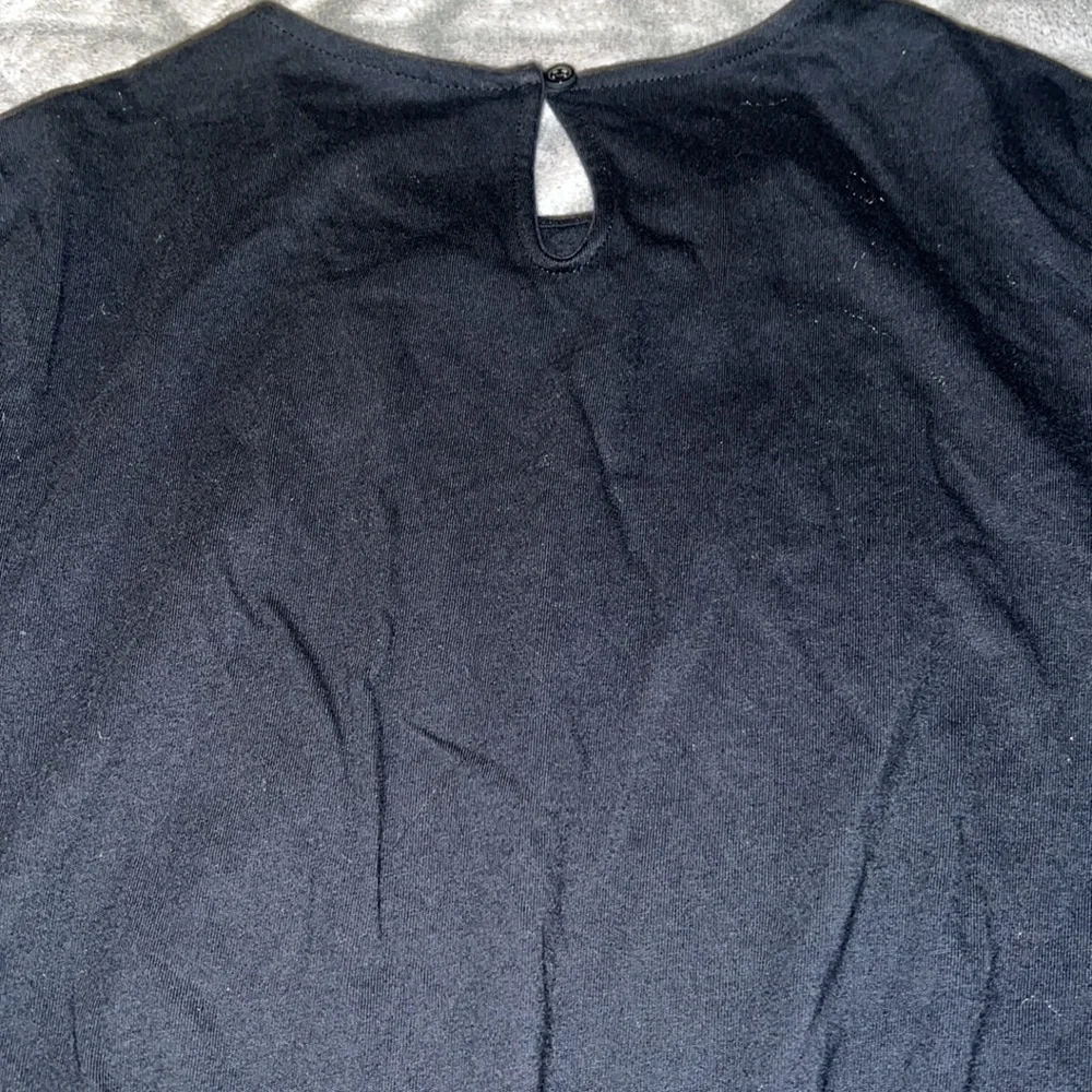 Carter’s Girl’s Black Long Sleeve With a Heart Detail.
